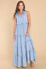 Full body view of this dress that features a subtle ruffle detailing throughout.
