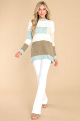 Full body view of this striped sweater that features a striped design, ribbed cuffs, and a soft fabric.