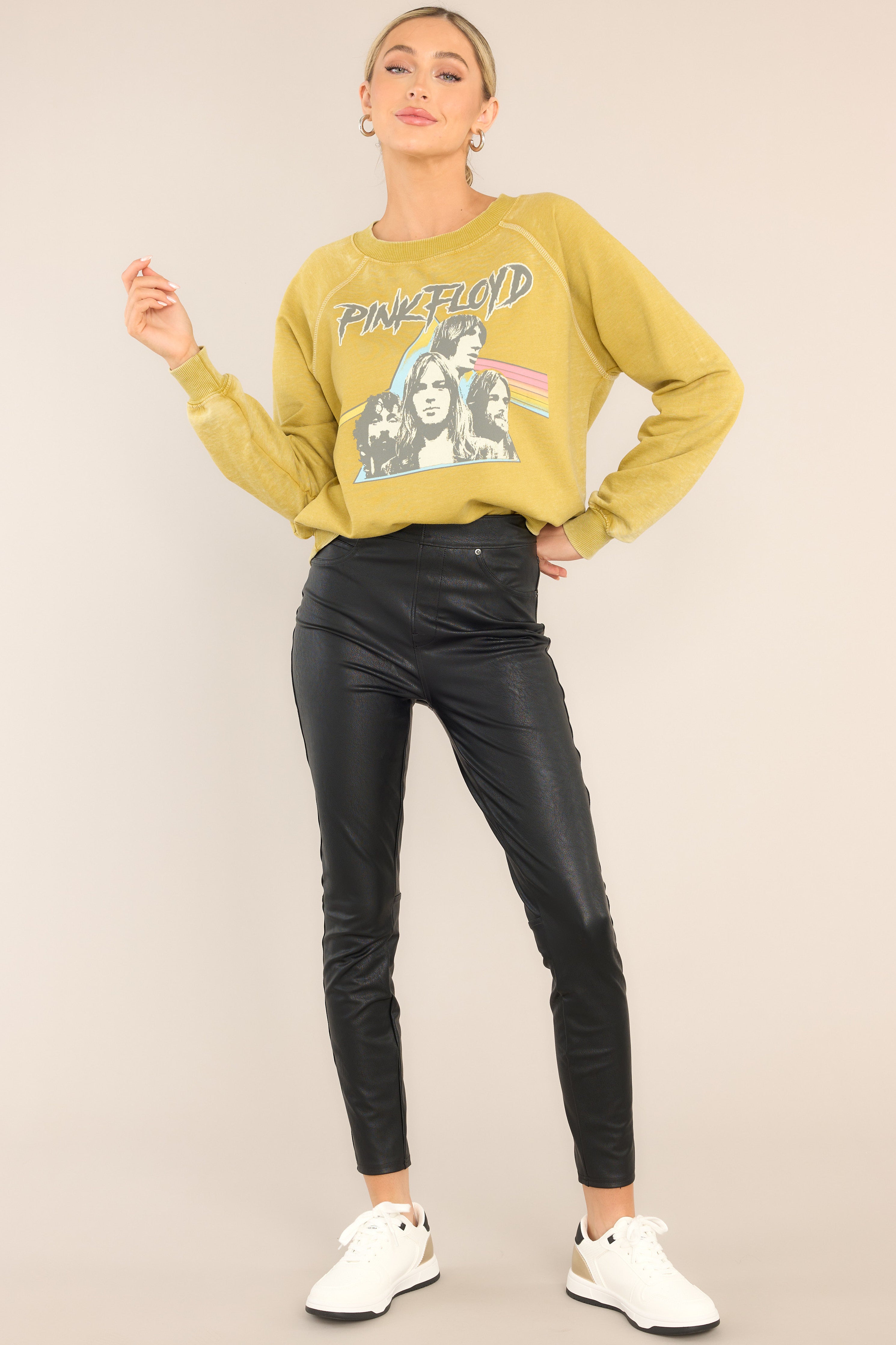 Full body view of this sweatshirt that features a ribbed crew neckline, exposed seams, graphic of the band members, 