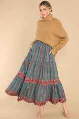 Full body view of  this soft sweater that features a very light eyelash knit design, a turtle cowl neckline, extremely dropped shoulders, and a slight high low hemline.