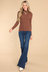 Full body view of fitted long sleeve top with ribbed detailing. 
