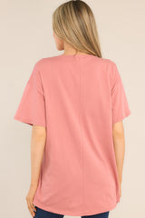 Back view of this top that features a crew neckline, dropped shoulders, a mountain graphic, and short sleeves.