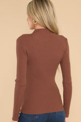 Back view of long sleeve top with a mock neck. 