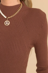 Detailed view of ribbed detailing on this chocolate brown top.  