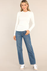 Full body view of this top that features a crew neckline, a ribbed texture, and long sleeves.