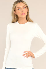 Front view of this top that features a crew neckline, a ribbed texture, and long sleeves.