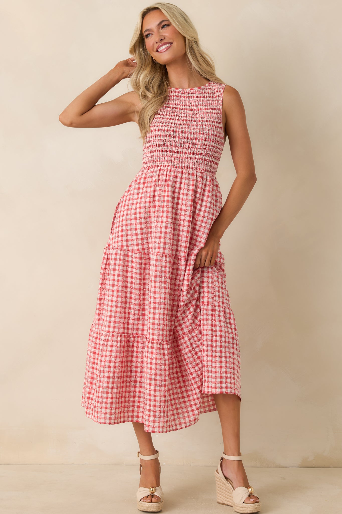 Red cotton dress highlighting a relaxed sleeveless fit with detailed embroidery throughout.