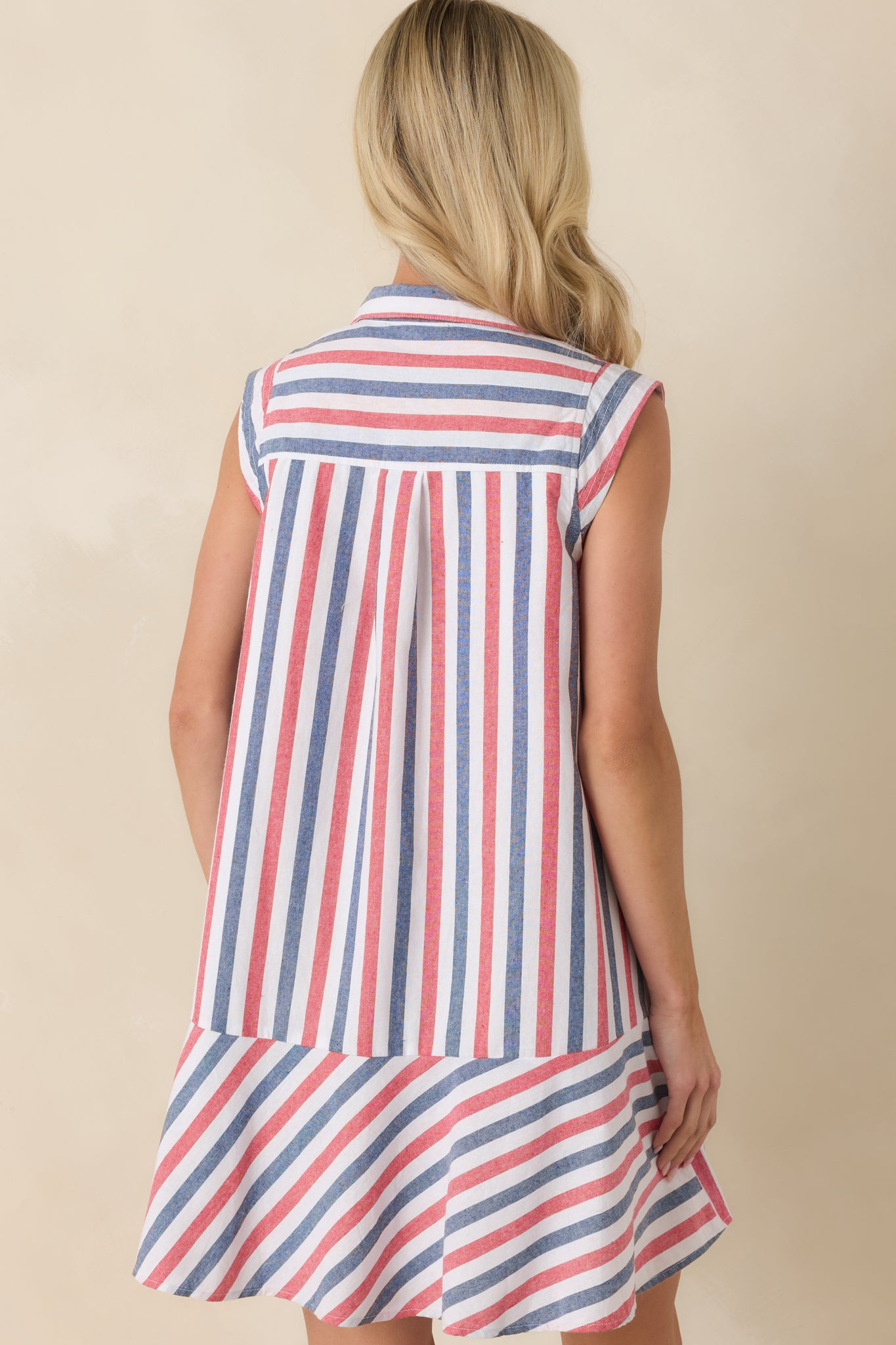 Rear view of the striped mini dress displaying the relaxed swing silhouette and mixed stripe pattern throughout.