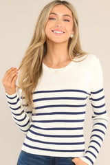 Front view of this top that features a crew neckline, long sleeves, soft ribbed fabric, and classic stripe pattern.