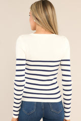 Back view of this top that features a crew neckline, long sleeves, soft ribbed fabric, and classic stripe pattern.