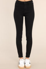 These black jeans feature a zipper and button closure, functional belt loops, and faux front pockets.