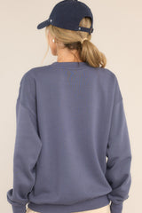Back view of this sweatshirt that features a crew neckline and ribbed hems.