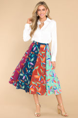 Full body view of this skirt that features a hook and zipper closure, boldly patterned panels, and a flowy skirt.