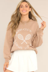 Model shown wearing Tan Embroidered Pullover Sweatshirt. 