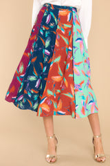 This multi-colored skirt features a hook and zipper closure, boldly patterned panels, and a flowy skirt.