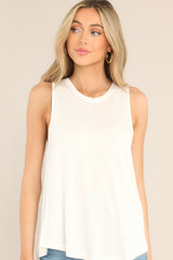Front view of this top that features a round neckline, a wide arm sleeveless design, and a flowy, breathable fabric.