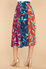 Back view of this skirt that features a hook and zipper closure, boldly patterned panels, and a flowy skirt.