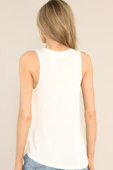 Back view of this top that features a round neckline, a wide arm sleeveless design, and a flowy, breathable fabric.