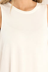 Close up view of this top that features a round neckline, a wide arm sleeveless design, and a flowy, breathable fabric.