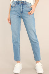 These medium wash jeans feature 5-pocket detailing and a standard zipper and button closure.
