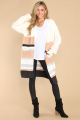 Full body view of  this cardigan that features two functional pockets.