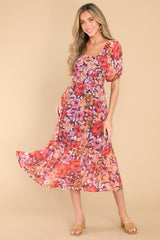 Full body view of this dress that showcases the floral pattern in shades of pink and orange.