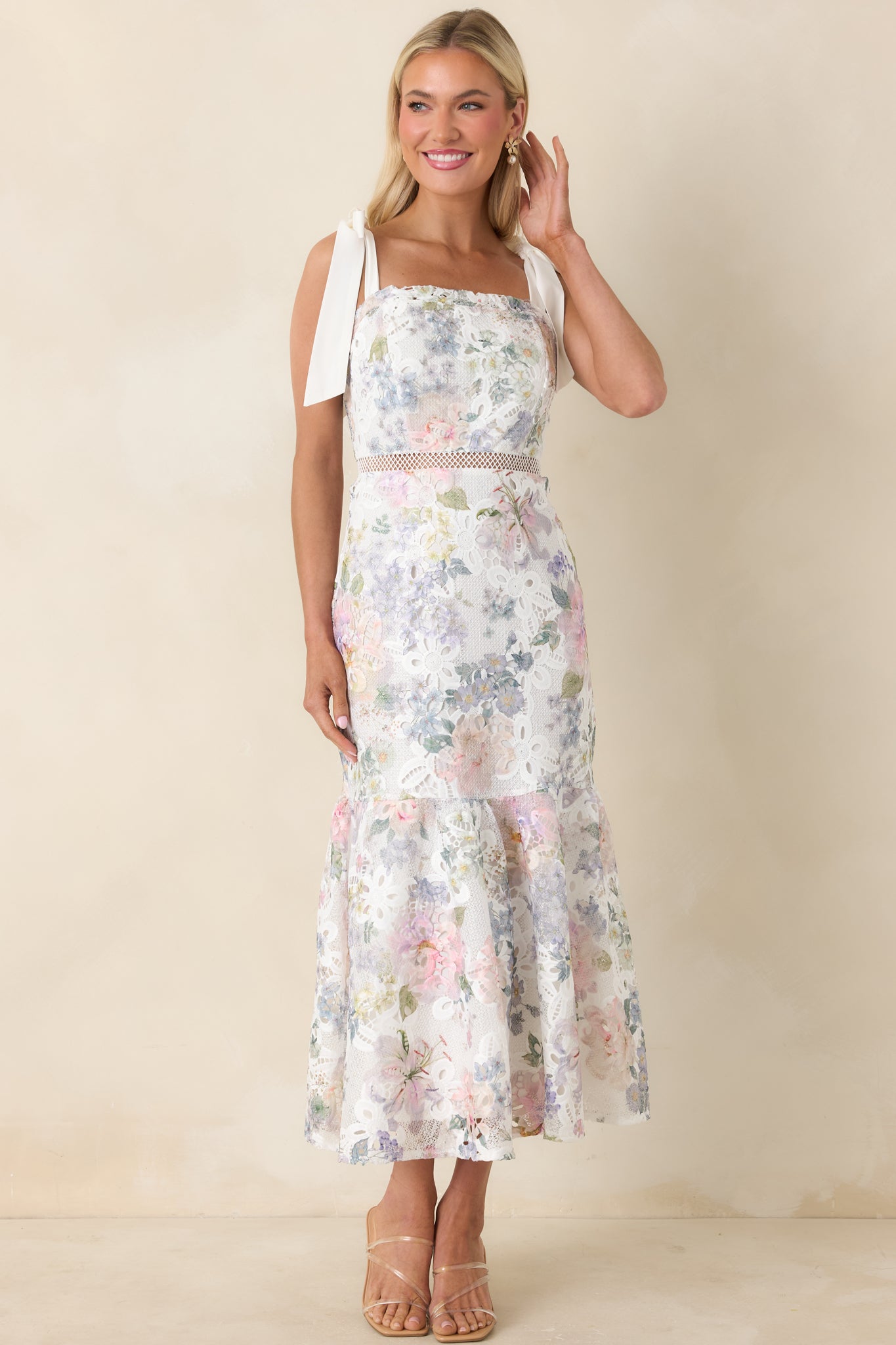 Front view highlighting the midi dress’s lace texture, square neckline, and single-tier silhouette.