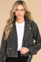 Front view of  this jacket that features a double breasted collar and a zipper closure.