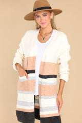 Front view of  this cardigan that features two functional pockets, and a soft material. 
