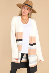 This multi-colored cardigan features two functional pockets, and a soft material. 