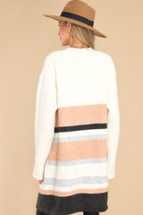 Back view of  this cardigan that features two functional pockets, and a soft material. 