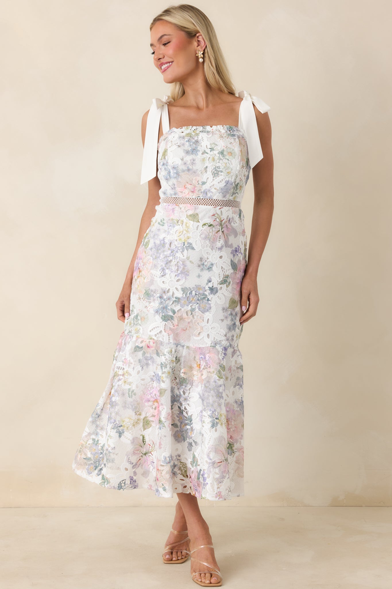 Front view of a midi dress with a square neckline, lace knit overlay, and single-tier skirt.