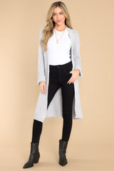 Full body view of this cardigan that features ribbed detailing at the cuffs and hemline.