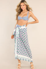 Full body view of this sarong that features a geometric pattern, and a silky fabrication.