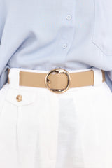 This beige belt features a circular buckle closure, and gold hardware. Its modern circle pin buckle adds a stylish touch, while the beige color goes well with any outfit. 