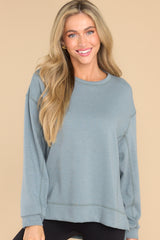 Front view of this top that features a scoop neckline and two slits at sides.