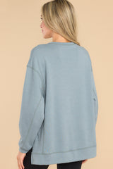 Back view of this top that features a scoop neckline and two slits at sides.