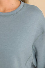 Close up view of this top that features a scoop neckline and two slits at sides.