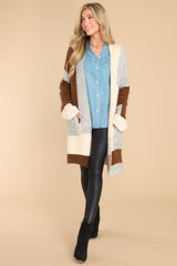 Full body view of this cardigan that features color blocking, two functional pockets, and an oversize fit.