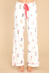 Front view of these pants that feature an elastic waistband, a self-tie drawstring, functional pockets, and a fun and festive print.