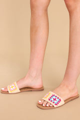 Full view of these sandals that feature a crochet detail over the foot and a slip-on style. 