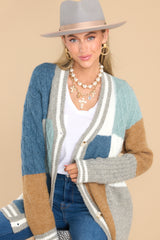 Front view of this cardigan that features stripe detailing along the hem and cuffs.
