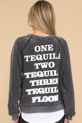 Back view of this sweatshirt that features a round neckline, long sleeves with ribbed cuffs, a ribbed bottom hem, and tequila-themed graphic lettering on the front and back.