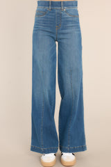 Relaxed waist down shot of Vintage Indigo Stretch Wide Leg Jeans that feature a front seam, faux front pockets, functional back pockets, a slip on design, and belt loops.