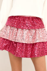 This pink skirt features a tiered pink sequin design, and a side zipper with hook & eye closure.