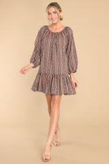 Full body view of this dress that showcases the vertical striped pattern of the fabric.