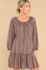 This multi-colored dress features a scoop neckline, elastic cuffed sleeves, and a tiered design.