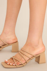 These camel colored heels feature a a square toe, multiple straps over the top of the foot, and a slip on design. 