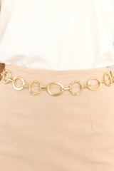 This gold chain belt features links of different textures and sizes, and a lobster claw closure.