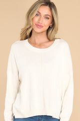 Front view of this sweater that features a crew neckline and cuffed sleeves.